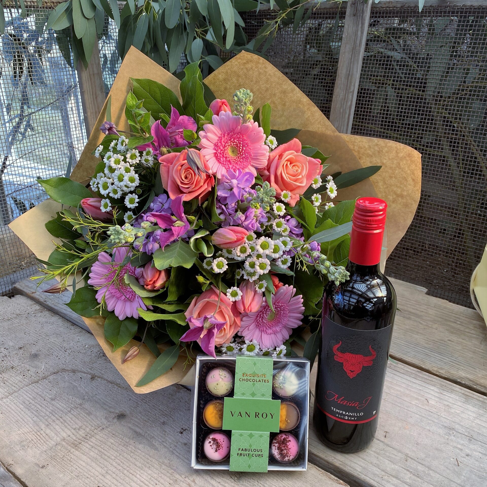 Gift bouquet with chocolates and wine – a high-value floral gift bundle offered by florists with an alcohol licence.